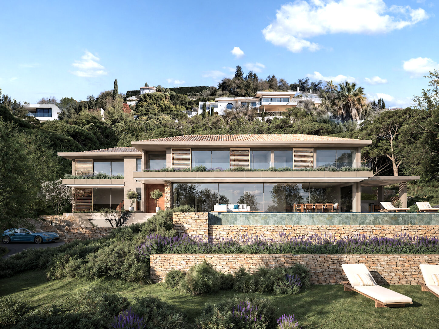 Vue d'ensemble de la Villa B et de sa piscine à débordement depuis le jardin — image non contractuelle
